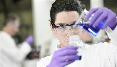 image of lab technician doing tests