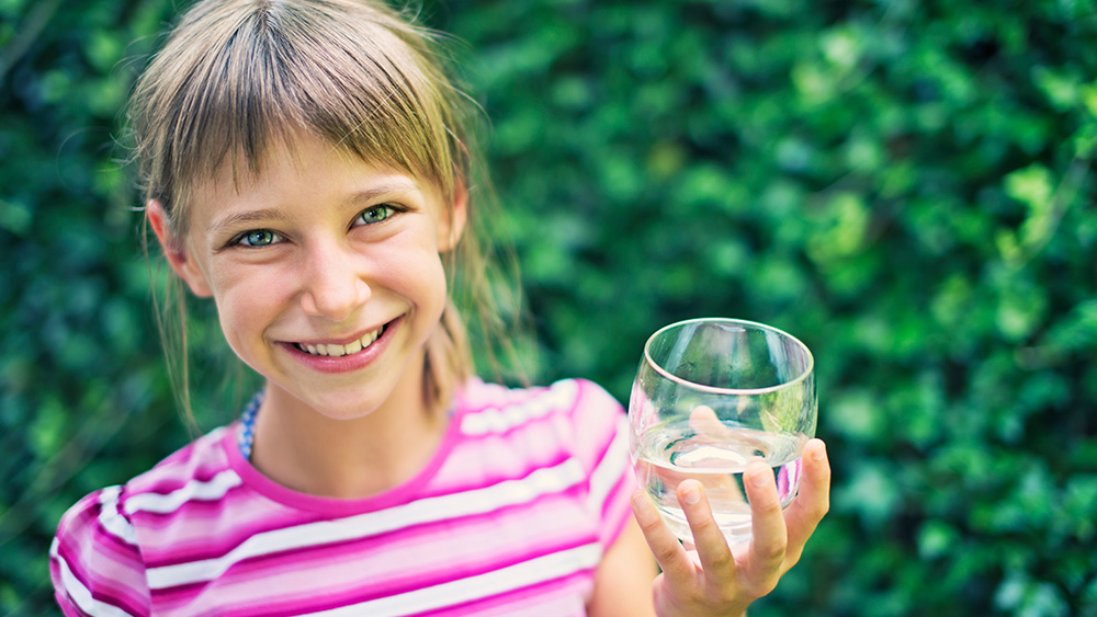 Girl with glass of water