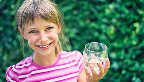 Girl with glass of water